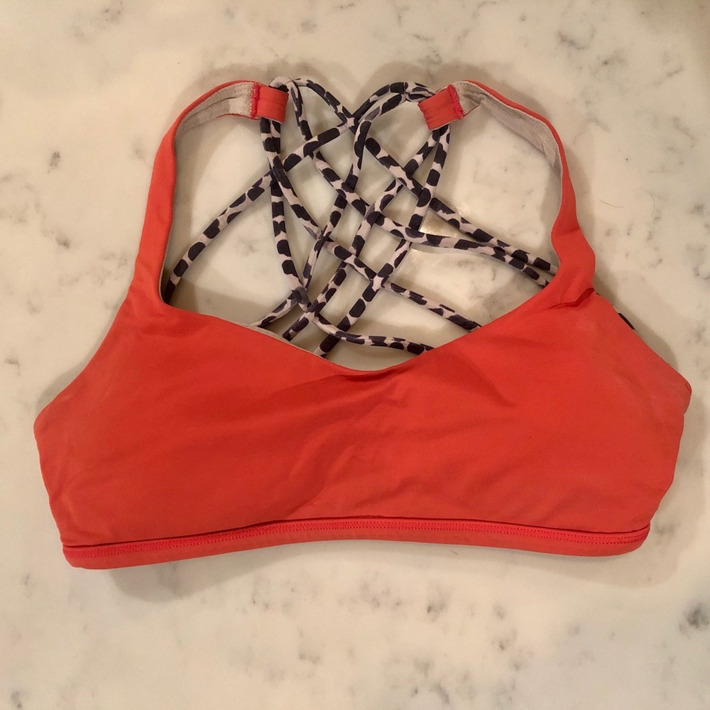 Orange lululemon sports bra.